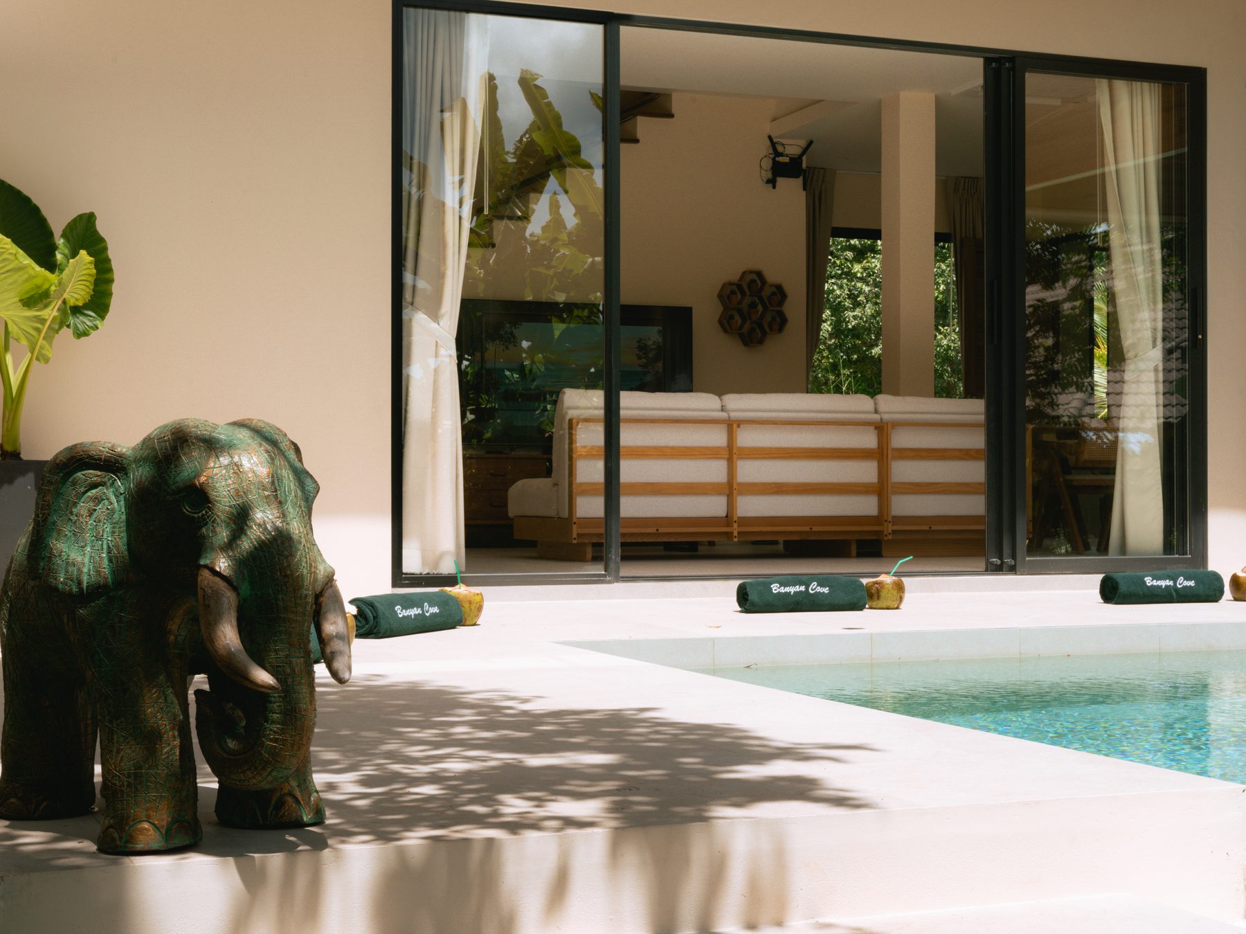 Glass doors opening to the pool